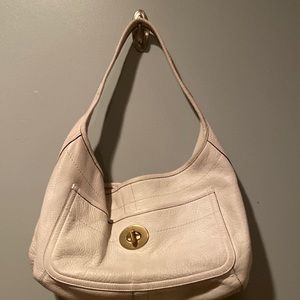 Cream Leather Coach Handbag with Gold Tone Hardware and Turquoise Interior.